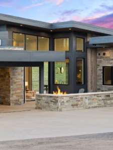 Exterior view of The Aspen Estate in the Promontory community, a custom home built by Big Canyon Homes in Park City, UT, with architecture by Bertoldi Architects and design by Kara Webster, ASID & Aja Webster Interior Design.