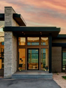 Exterior view of Holly Estate in the Glenwild community, a custom home built by Big Canyon Homes in Park City, UT, with architecture by Otto/Walker Architects.