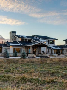 Exterior view of The Meadow House, a custom home built by Big Canyon Homes in Huntsville, UT, with architecture by Mark Design Inc. and design by Kara Webster, ASID & Aja Webster Interior Design.