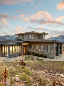 Exterior view of The Retreat, a custom home built by Big Canyon Homes in Eden, UT, with architecture by Mark Design Inc. and design by Kara Webster, ASID & Aja Webster Interior Design.