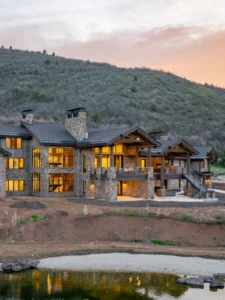 Exterior view of Huntsville Hideout, a custom home built by Big Canyon Homes in Huntsville, Utah, with architecture by The Highland Group and design by Kara Webster, ASID & Aja Webster Interior Design.